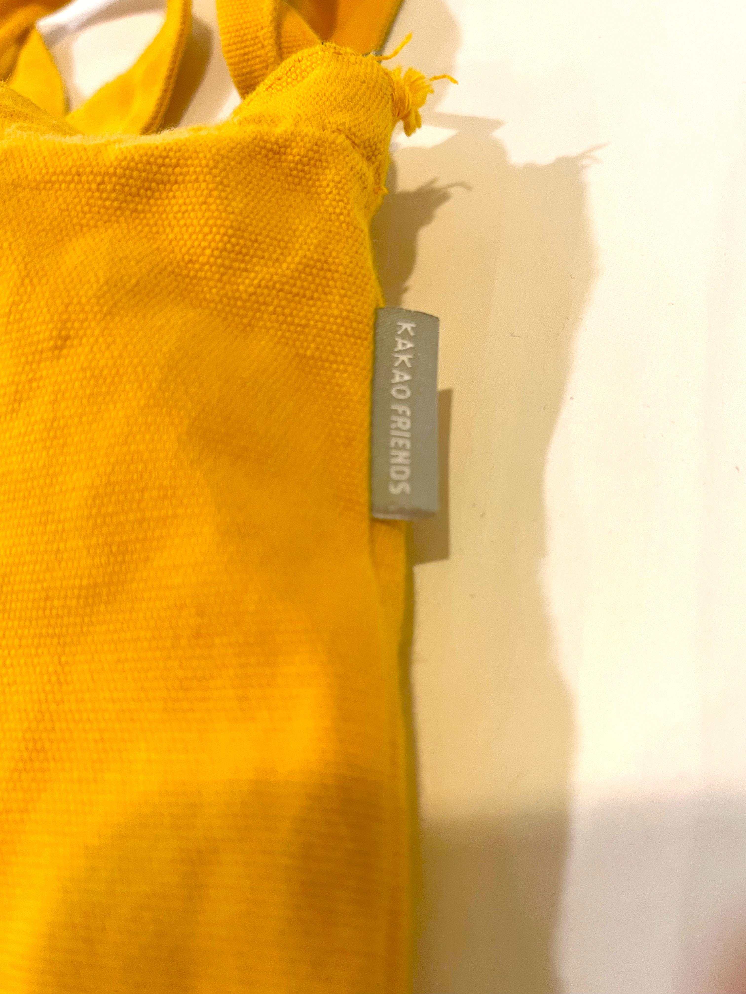 Ryan Kakao Friends Tote Bag (Category: Tote Bags) located in Paranaque City. Submitted by ymrtn (Listing ID 1176705877, Image 3). Description: Rly cute tote w a pocket inside and an adjustable strap. Has a small tear on the upper side but its chill Condition: 8.5/10, my go-to tote but its still very functional and still looks very much like ryan :D RFS: decluttering.