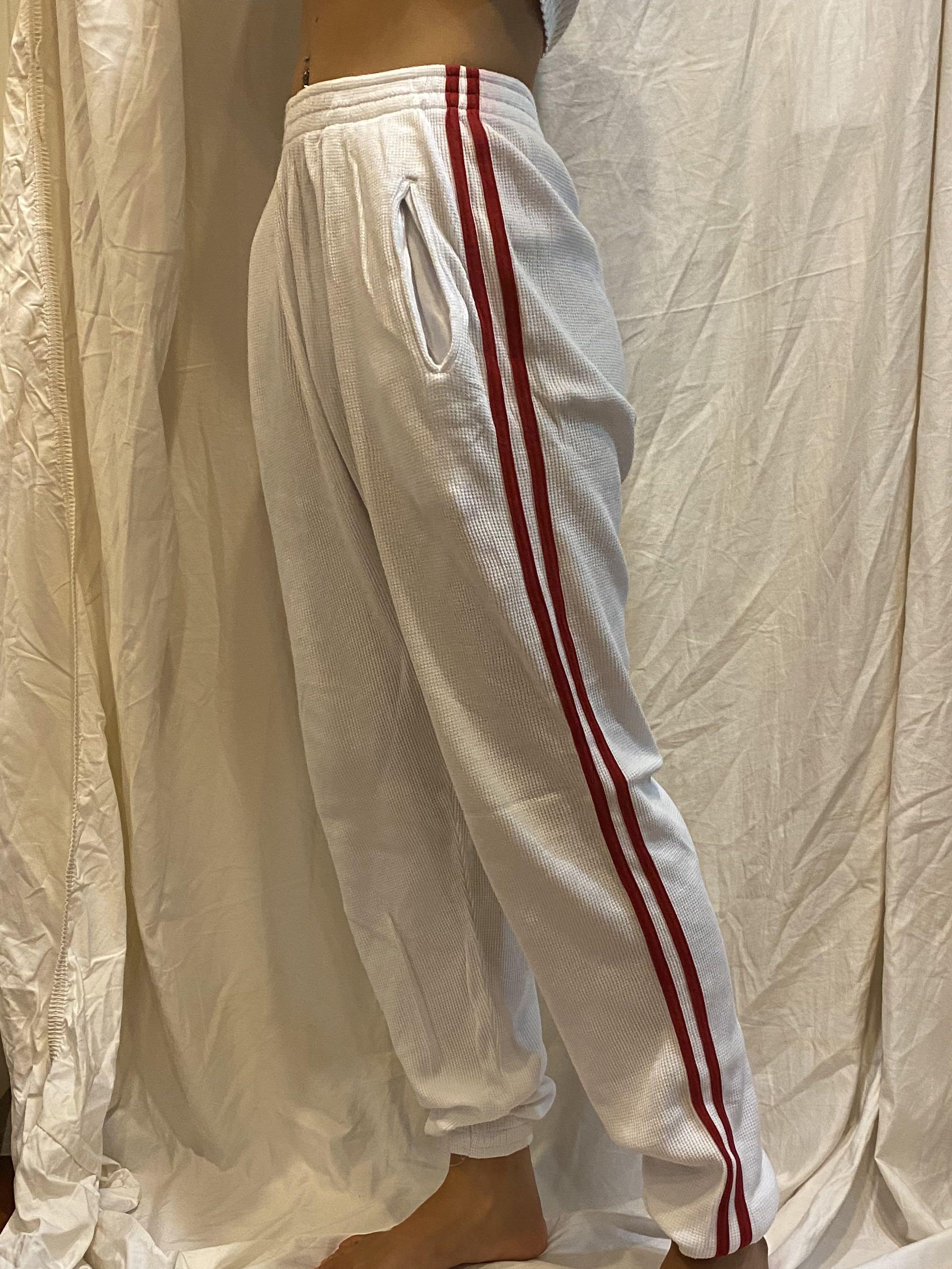 White sweatpants red top stripe