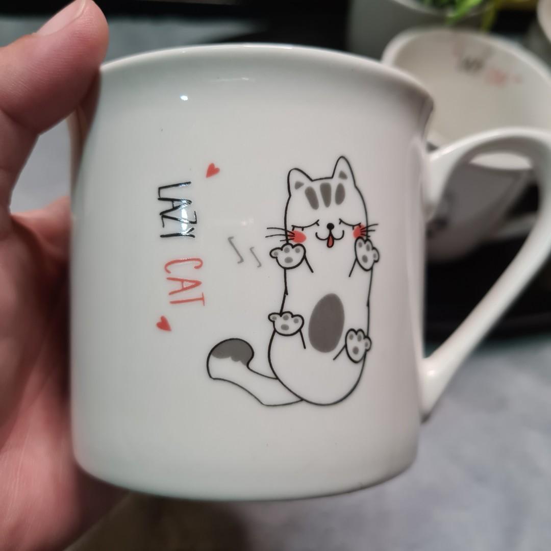 3 PCS. CAT LOVER COFFEE MUG BUNDLE - LAZY CAT DESIGNS (Category: Coffee & Tea Tableware) located in Bulacan. Submitted by sakurajade (Listing ID 1177292929, Image 2). Description: 3 PCS. CAT LOVER COFFEE MUG BUNDLE - LAZY CAT DESIGNS 👉Price: P310 ONLY ✅️ Good condition, almost brand new, dinnerwares, decorative bundles, no chips ✅️ Material: Fine ceramic ✅️ Issue: No box, see photo for other issue.