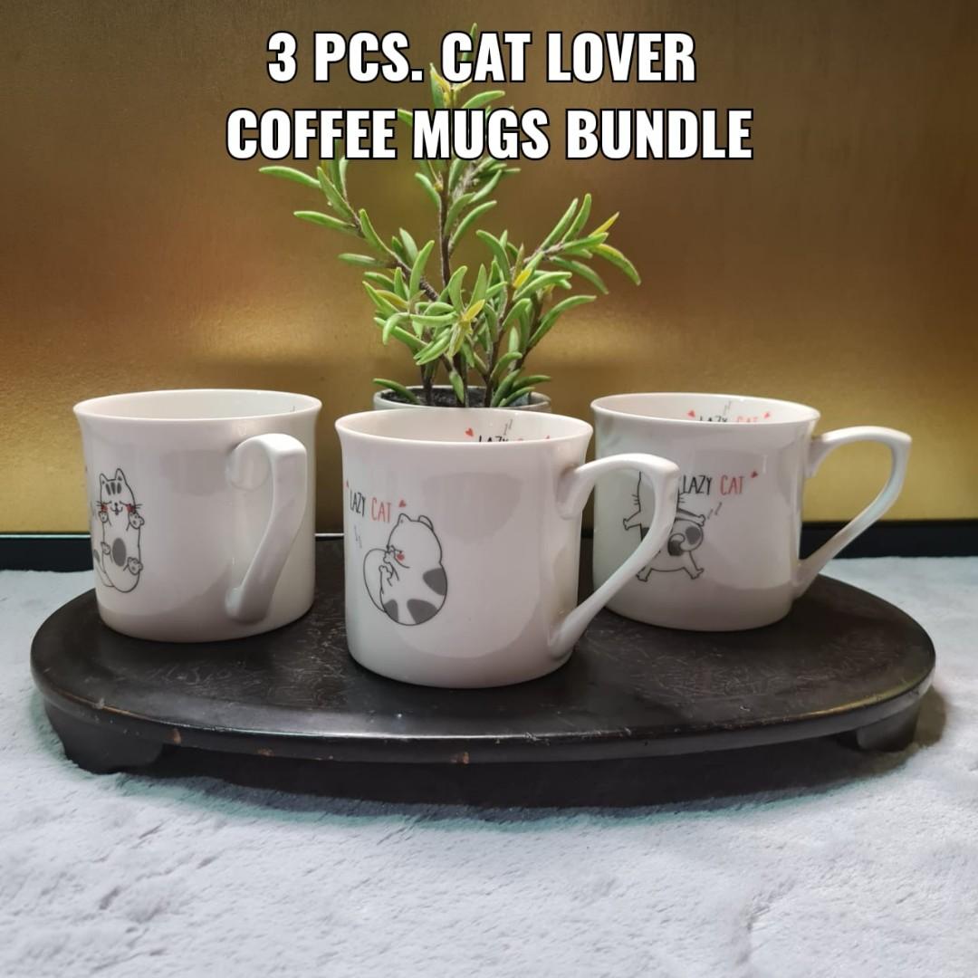 3 PCS. CAT LOVER COFFEE MUG BUNDLE - LAZY CAT DESIGNS (Category: Coffee & Tea Tableware) located in Bulacan. Submitted by sakurajade (Listing ID 1177292929, Image 1). Description: 3 PCS. CAT LOVER COFFEE MUG BUNDLE - LAZY CAT DESIGNS 👉Price: P310 ONLY ✅️ Good condition, almost brand new, dinnerwares, decorative bundles, no chips ✅️ Material: Fine ceramic ✅️ Issue: No box, see photo for other issue.