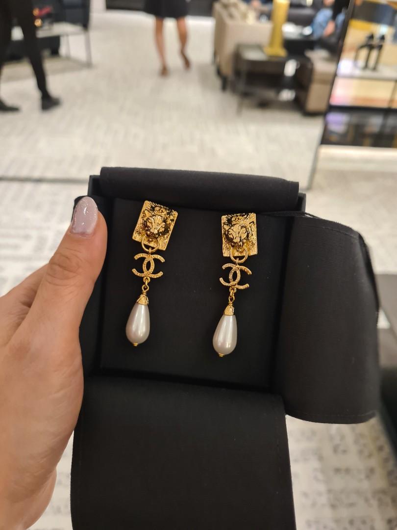 Chanel lion earrings