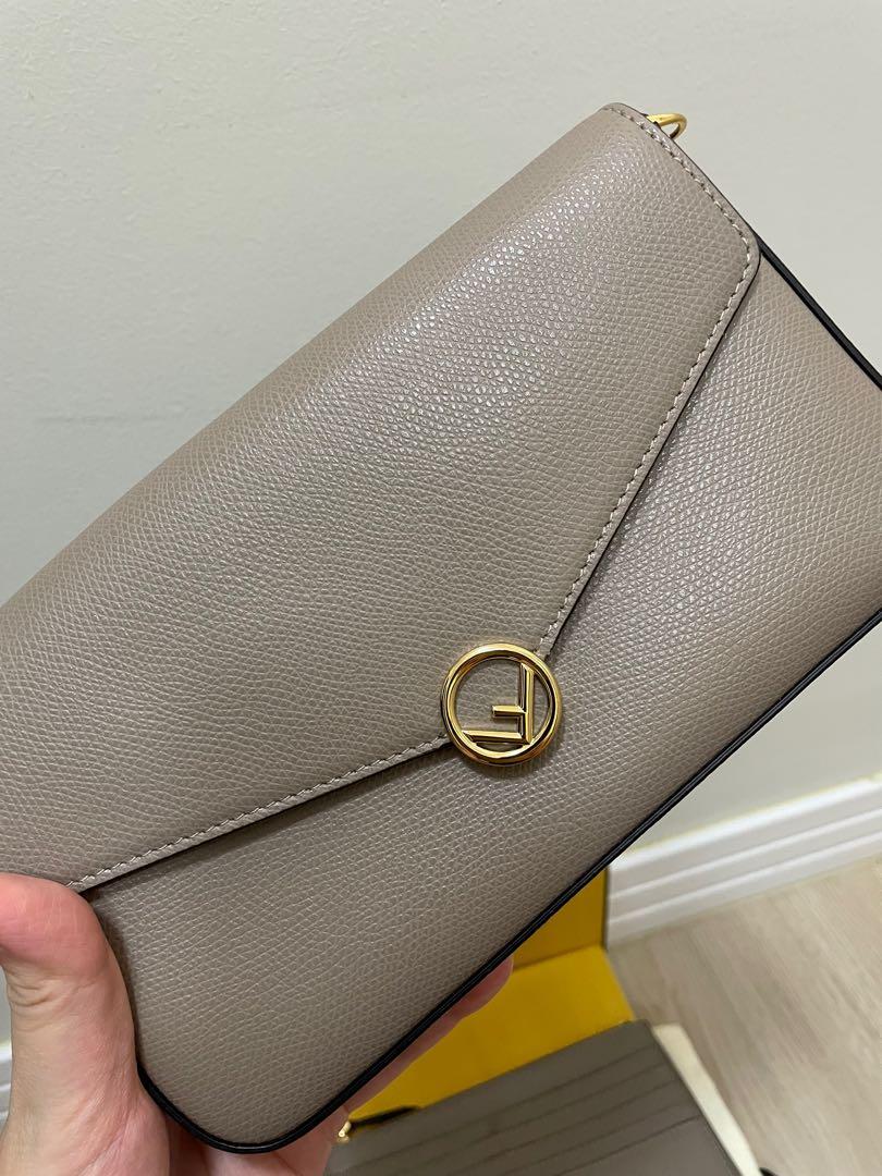 Fendi wallet on chain with removal pouch (Category: Luxury Bags & Wallets) located in Taguig. Submitted by dangruizdee (Listing ID 1177437176, Image 2). Description: Unused condition Grained leather Comes with gold chain, 2 removable pouch, dustbag and box Same size/look as LV Felicie.