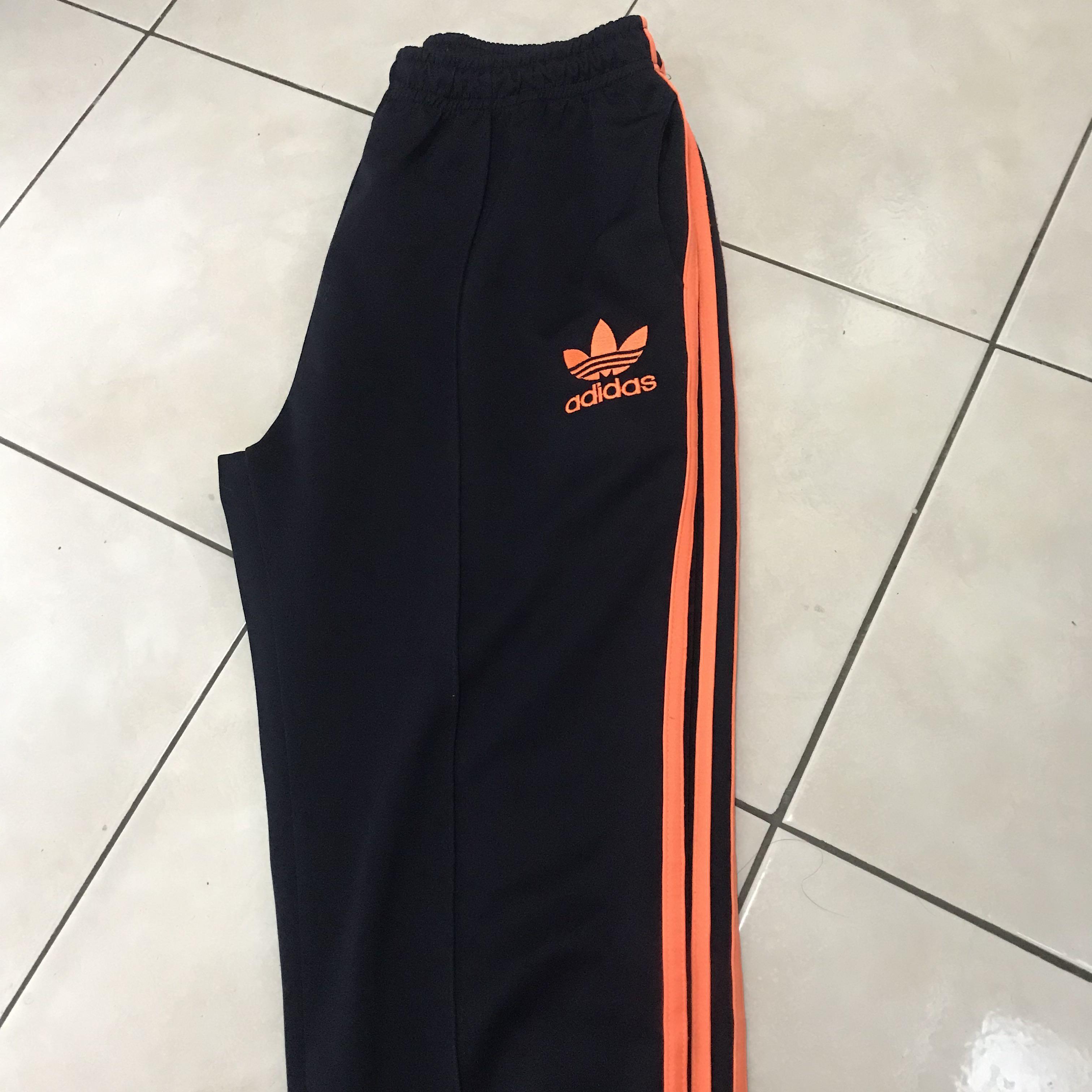 Orange stripe adidas deals pants