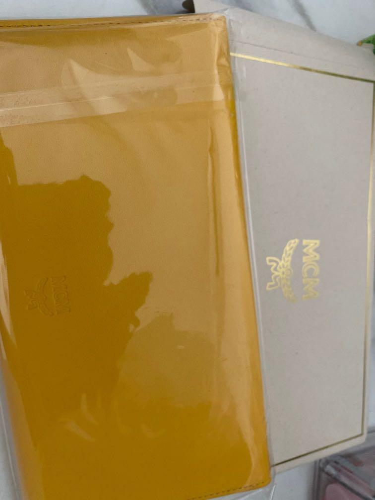 Mcm long wallet (Category: Bags & Wallets) located in Singapore. Submitted by happyshoppingonline (Listing ID 1177492510, Image 1). Description: Long wallet for mcm yellow . Once the item has been so cannot be refund. Confirm the item must be reserve by pay now 50% of the price .