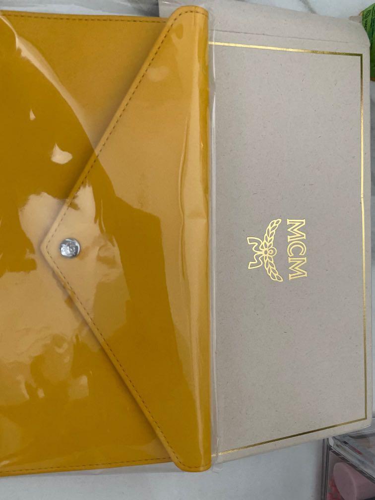 Mcm long wallet (Category: Bags & Wallets) located in Singapore. Submitted by happyshoppingonline (Listing ID 1177492510, Image 2). Description: Long wallet for mcm yellow . Once the item has been so cannot be refund. Confirm the item must be reserve by pay now 50% of the price .