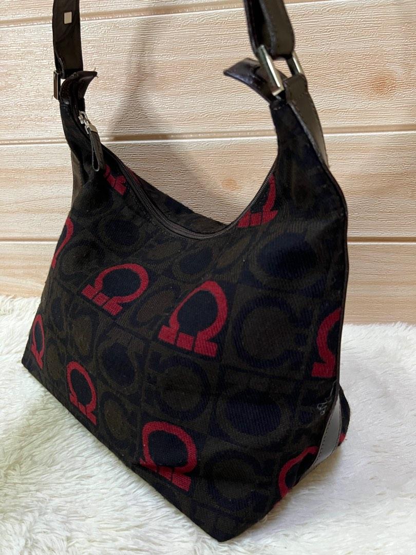 Authentic Ferragamo Hobo Bag (Category: Luxury Bags & Wallets) located in Cagayan de Oro. Submitted by riggstuffs (Listing ID 1182254718, Image 2). Description: Guaranteed Authentic Ferragamo Hobo Bag Made in Italy With code Exterior is of fabric material embossed with the Ferragamo logo No flaws, no rubs or rips of the fabric material Gentle signs of use only Interior is in very good condition, very clean and has a zipper compartment Handles and