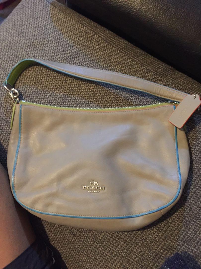 Coach Chelsea 2-way Shoulderbag (Category: Luxury Bags & Wallets) located in Baguio. Submitted by BagstacularbyJCT (Listing ID 1182235633, Image 2). Description: Coach 2-way kili or sling. Gray soft leather with multicolor trims. Silver hardware and green inner lining. Inside zip pocket Zip-top closure, fabric lining. Minimal signs of use. Handle with 7 1/2" drop 11 1/4" (L) x 7 1/2" (H) x 3" (W) Detachable strap with 22" drop for shoulder or cro