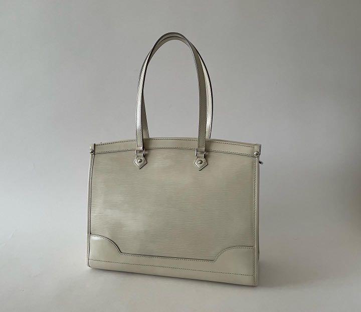 LV MADELEINE EPI TOTE GM (Category: Luxury Bags & Wallets) located in Taguig. Submitted by sweetluxuryph (Listing ID 1182294936, Image 3). Description: 💯 GUARANTEED AUTHENTIC 35,000 Ivory or Off White Textured epi leather w/ Smooth leather details Silver tone hardware Dimensions-13.5”x10”x5” Handle drop-8.5” Good condition, rank a-ab No obvious flaw outside Comes with card & dustbag https://instagram.com/sweetluxury2008?igshid=YmMyMTA2M2Y= https