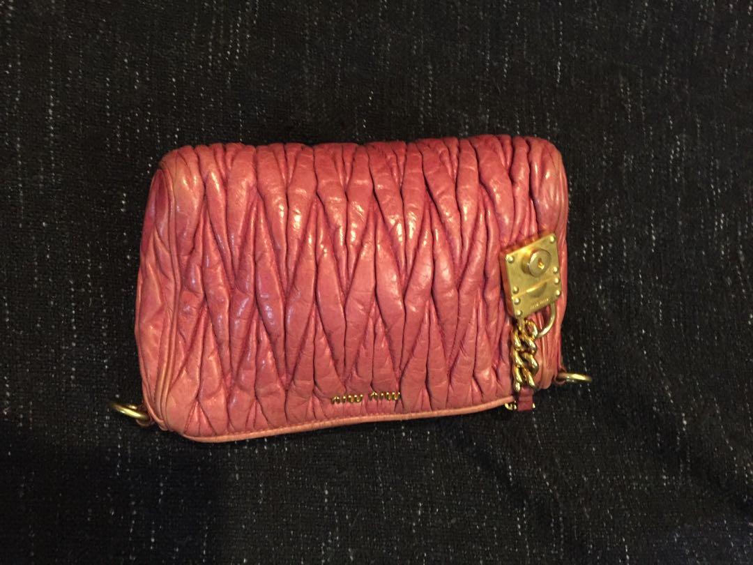 Miu Miu Matellase Charm (Category: Luxury Bags & Wallets) located in Baguio. Submitted by BagstacularbyJCT (Listing ID 1182267016, Image 2). Description: Miu Miu matellase charm pouch in pink. Has signs of use and color rubouts. Detailed pictures provided.