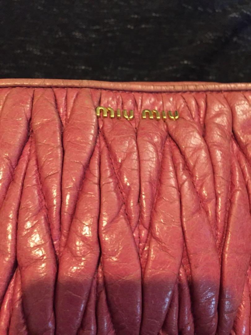 Miu Miu Matellase Charm (Category: Luxury Bags & Wallets) located in Baguio. Submitted by BagstacularbyJCT (Listing ID 1182267016, Image 3). Description: Miu Miu matellase charm pouch in pink. Has signs of use and color rubouts. Detailed pictures provided.