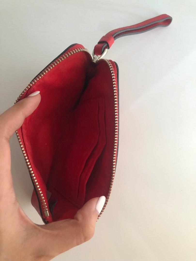 Orig COACH red zip wallet wristlet (Category: Purses & Pouches) located in Pasig City. Submitted by dstarcloset (Listing ID 1182207310, Image 3). Description: •COACH red zip wallet wrislet •Bought in US, sure authentic •Preloved •In good condition •Lightweight •Nice leather quality, it never worn out even if you store in closet for a long time •Texture is smooth, can easily wipe liquid/spills outside of the wallet •I have 2 different designs (see