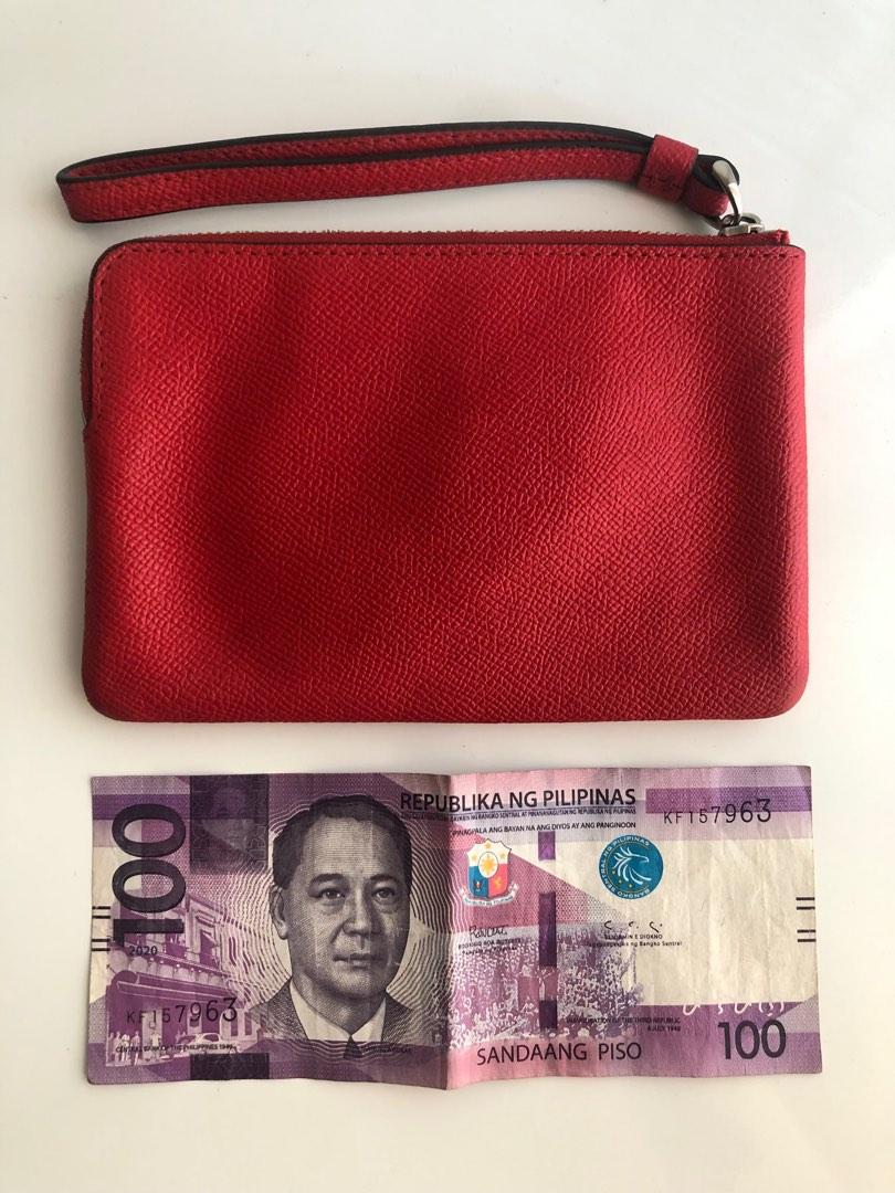 Orig COACH red zip wallet wristlet (Category: Purses & Pouches) located in Pasig City. Submitted by dstarcloset (Listing ID 1182207310, Image 2). Description: •COACH red zip wallet wrislet •Bought in US, sure authentic •Preloved •In good condition •Lightweight •Nice leather quality, it never worn out even if you store in closet for a long time •Texture is smooth, can easily wipe liquid/spills outside of the wallet •I have 2 different designs (see