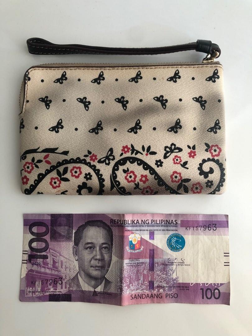Orig COACH white printed zip wallet wrislet (Category: Purses & Pouches) located in Pasig City. Submitted by dstarcloset (Listing ID 1182210000, Image 2). Description: •COACH white printed zip wallet wrislet •Bought in US, sure authentic •Preloved •Used and abused •Lightweight •Nice leather quality, it never worn out even if you store in closet for a long time •Texture is smooth, can easily wipe liquid/spills outside of the wallet •I have 2 diffe