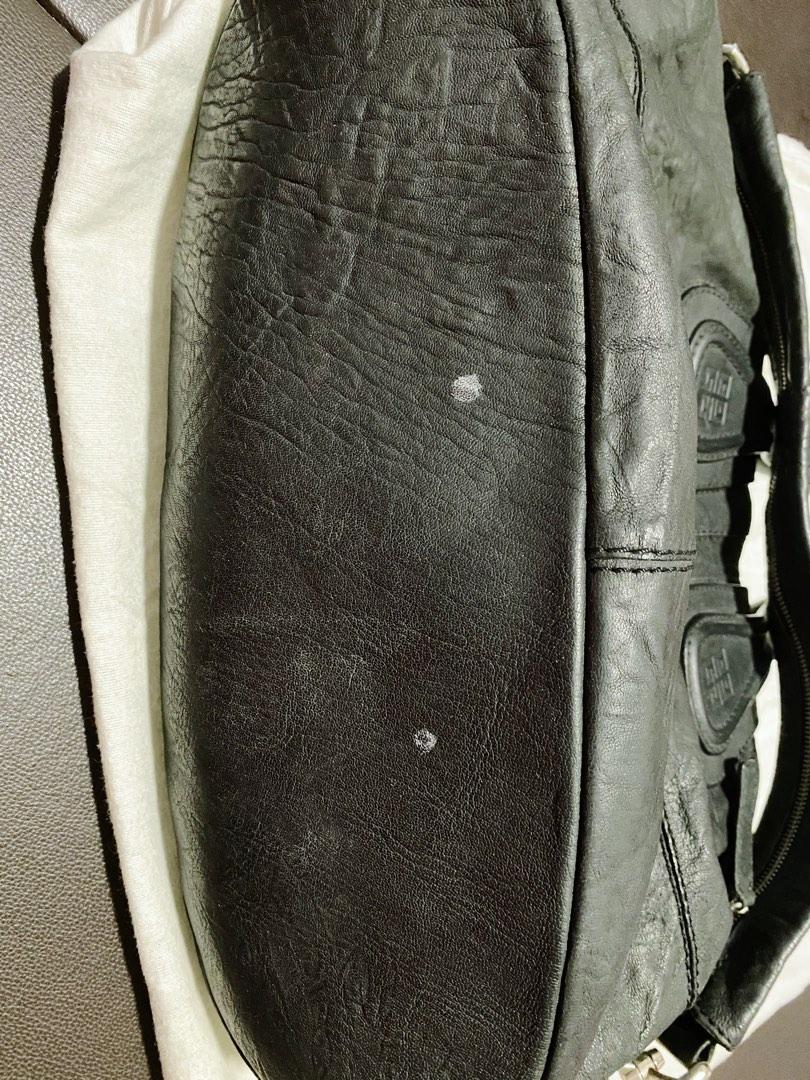 Givenchy Nightingale Medium Bag in black (Category: Luxury Bags & Wallets) located in Quezon City. Submitted by mjcong (Listing ID 1183996319, Image 2). Description: Guaranteed Authentic. Signs of used. There are few spot stains. One of the strap got torn so replaced with giant pin handle. Complete with dustbag and authentic card..