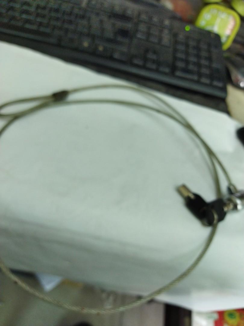 Laptop lock (Category: Other Accessories) located in Manila. Submitted by kchingx (Listing ID 1184091380, Image 1). Description: laptop lock with to two keys.