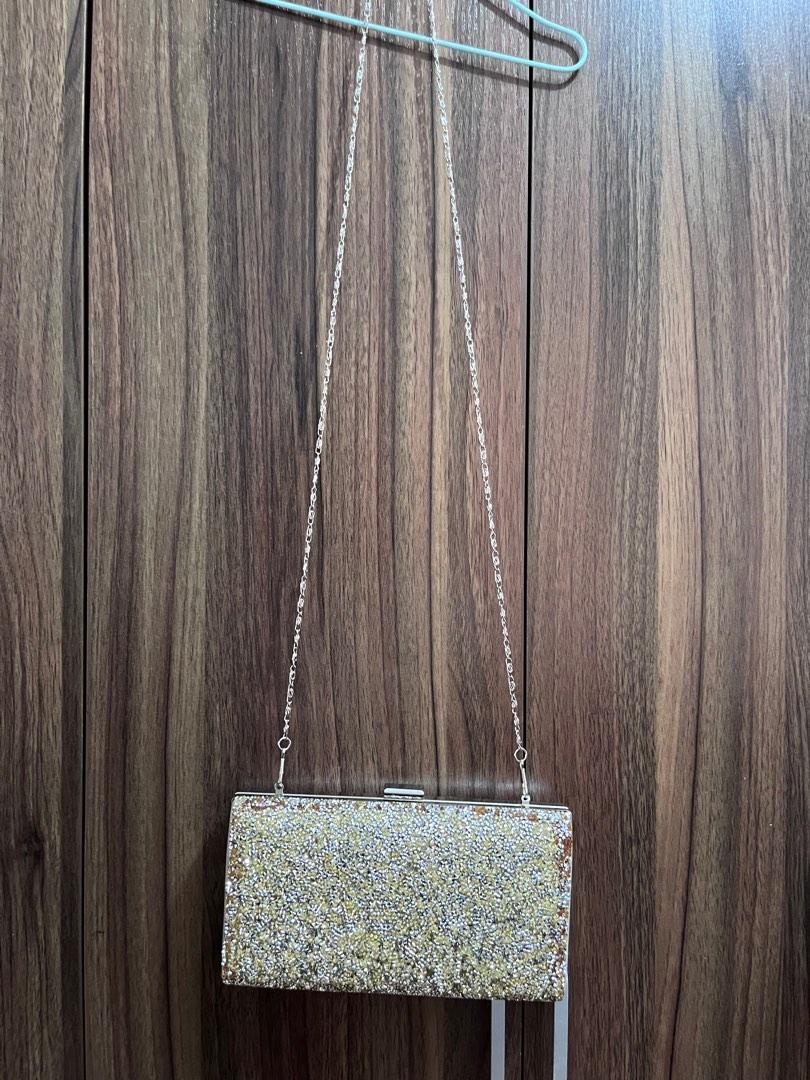 Silver clutch (Category: Clutches) located in General Trias. Submitted by ClosetCleanup (Listing ID 1184164454, Image 1). Description: Used only once during an event. Stuck in the closet for a looong time! Has signs of wear due to storage. But will become unnoticeable if youre attending an evening party. See photos. RFS: decluttering.