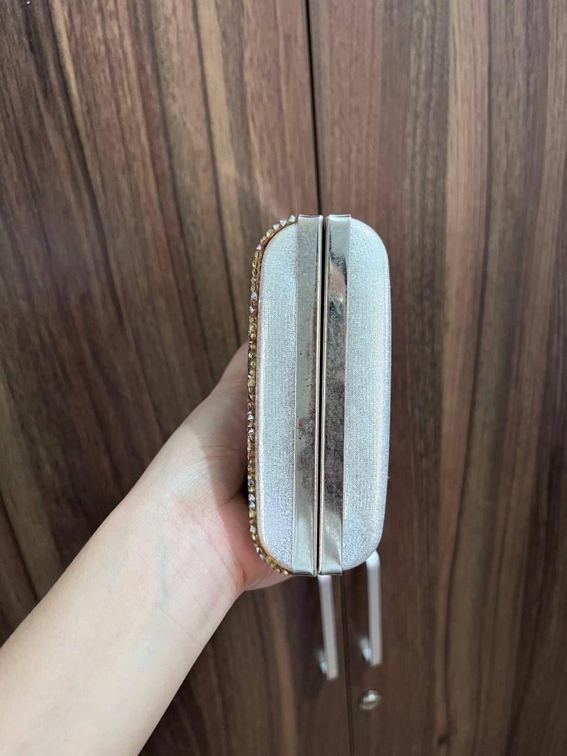 Silver clutch (Category: Clutches) located in General Trias. Submitted by ClosetCleanup (Listing ID 1184164454, Image 3). Description: Used only once during an event. Stuck in the closet for a looong time! Has signs of wear due to storage. But will become unnoticeable if youre attending an evening party. See photos. RFS: decluttering.