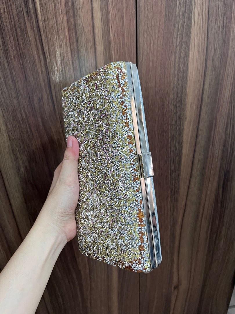 Silver clutch (Category: Clutches) located in General Trias. Submitted by ClosetCleanup (Listing ID 1184164454, Image 2). Description: Used only once during an event. Stuck in the closet for a looong time! Has signs of wear due to storage. But will become unnoticeable if youre attending an evening party. See photos. RFS: decluttering.