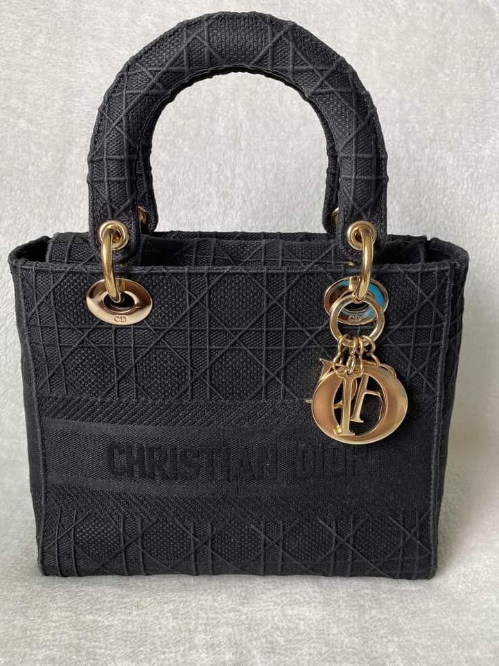 Lady Dior Medium D-lite (Category: Luxury Bags & Wallets) located in Manila. Submitted by bagislifeshop (Listing ID 1184408876, Image 2). Description: ▪️Lady Dior Medium D-lite▪️ ☑️In transit to Manila ✅Condition: 8.8/10 (with initials at the back exterior) ✅Material: Lambskin leather ✅Colour: Black in SHW ✅Inclusions: dust bag and long strap.