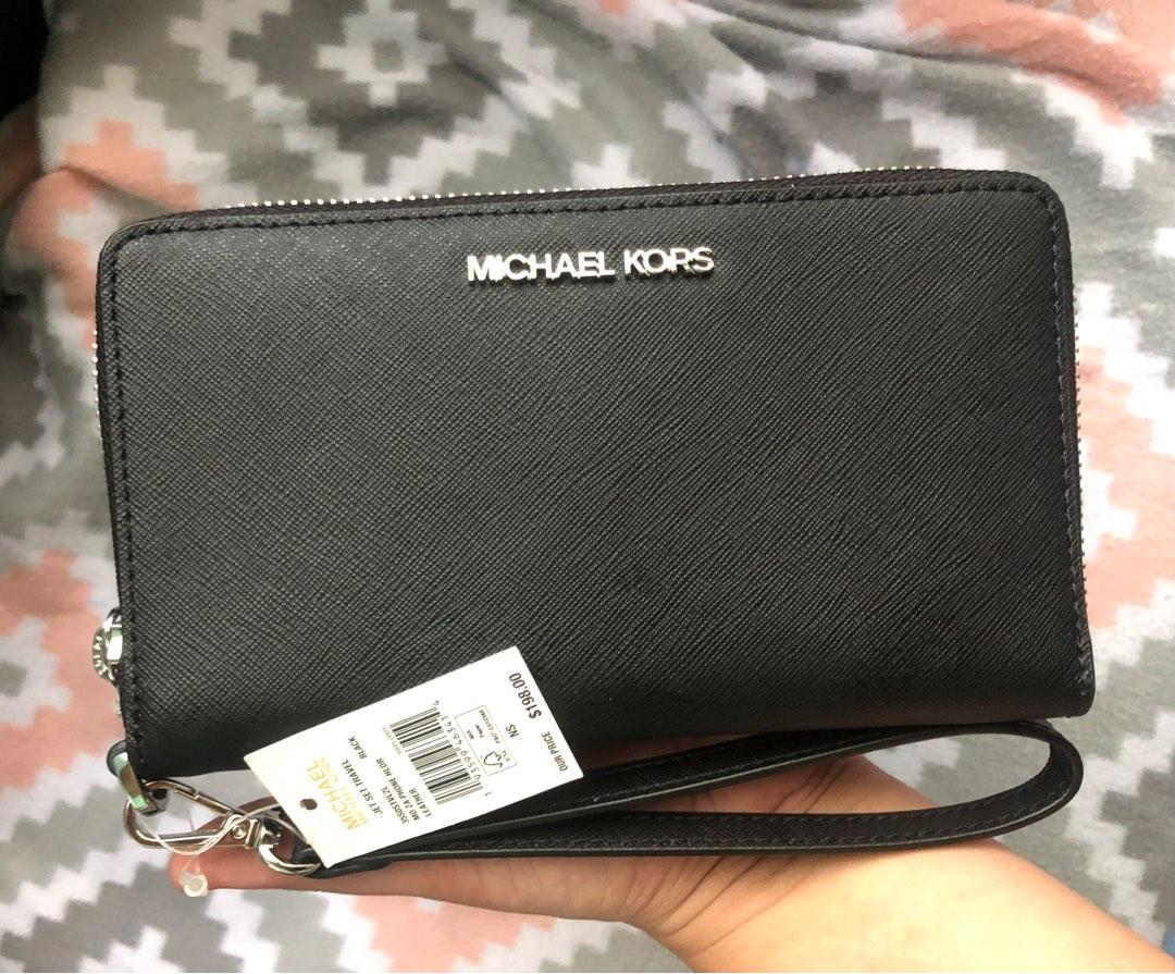 Michael Kors Jet Set Travel Medium zip around phone holder, Women's  Fashion, Bags & Wallets, Wallets & Card holders on Carousell