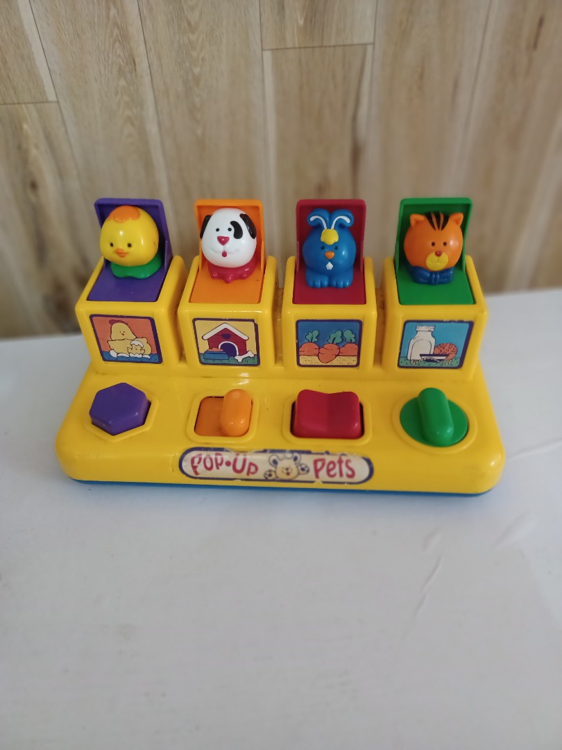 Pop up pets toy top