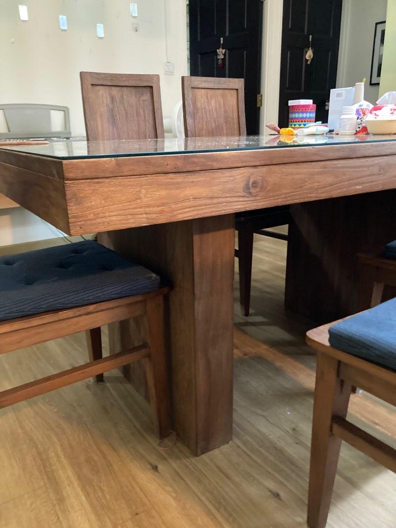 Solid Teak Dining Set (Category: Tables & Sets) located in Singapore. Submitted by haechoo (Listing ID 1184329317, Image 3). Description: A well kept solid recycled teak dining set, designed by us and made in Indonesia. Very sturdy. Comes with ikea seat cushions and glass for table top. 160cm x 80cm x 80cm (height).