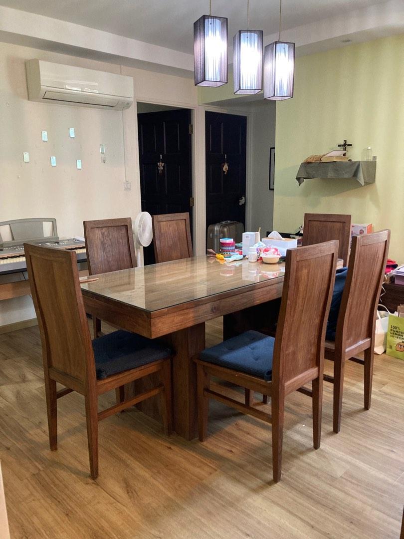 Solid Teak Dining Set (Category: Tables & Sets) located in Singapore. Submitted by haechoo (Listing ID 1184329317, Image 1). Description: A well kept solid recycled teak dining set, designed by us and made in Indonesia. Very sturdy. Comes with ikea seat cushions and glass for table top. 160cm x 80cm x 80cm (height).