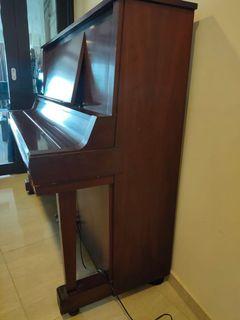Upright standing grand piano
