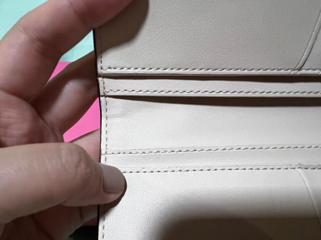 Kate spade knott zip slim wallet, Women's Fashion, Bags & Wallets, Wallets  & Card holders on Carousell