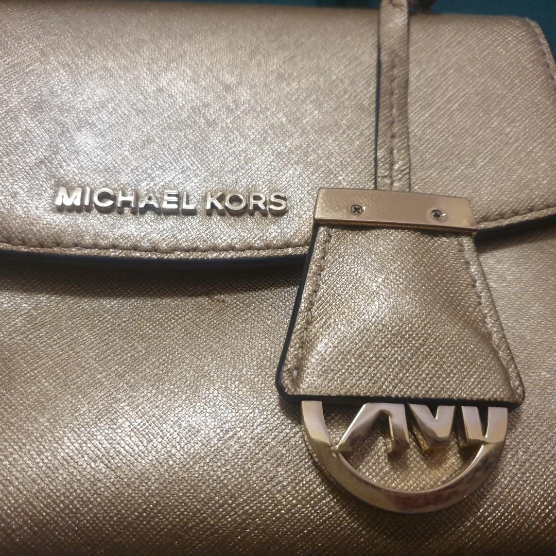 Michael Kors golden small purse bought in Las Vegas USA, Luxury, Bags &  Wallets on Carousell