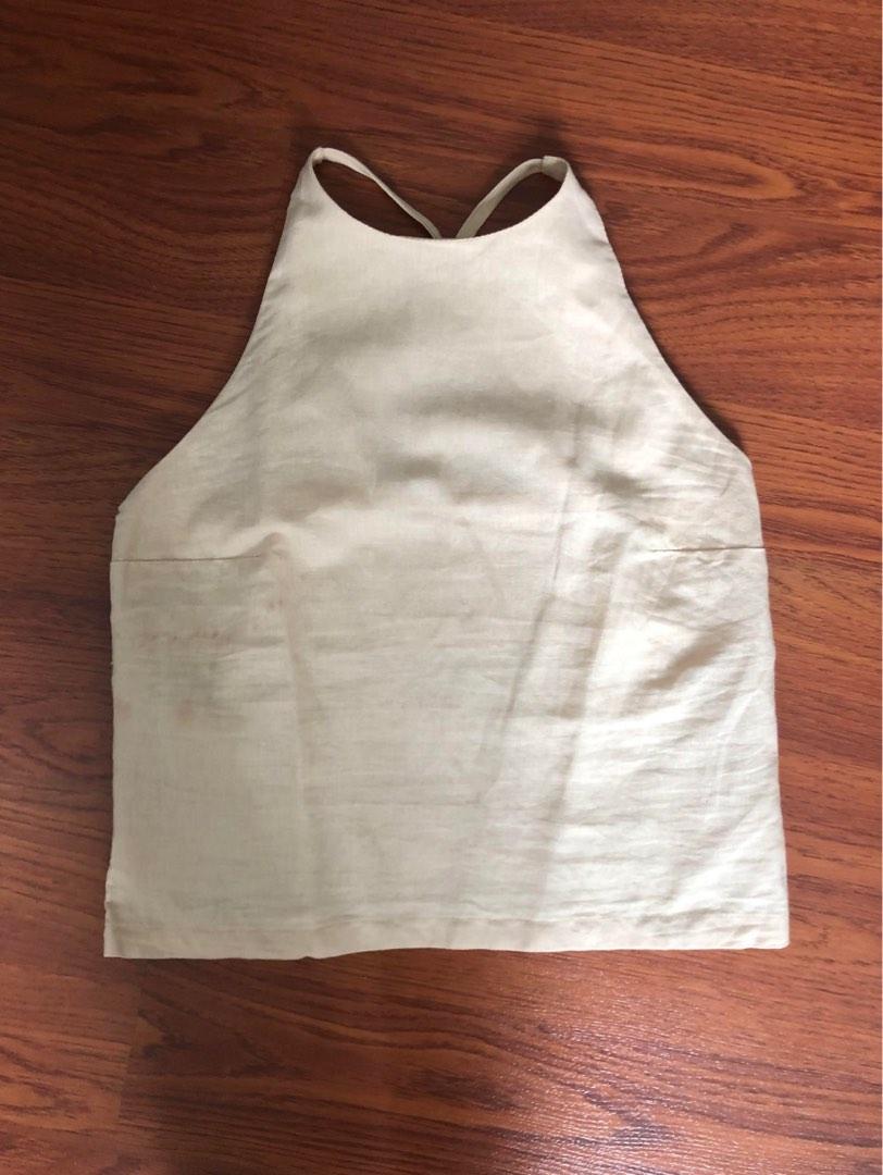 Oat/Beige Linen Top (Category: Sleeveless) located in Quezon. Submitted by indmlnt (Listing ID 1184980246, Image 1). Description: Washed but never worn Bought it with slight stain (see photos) Retail price is 1,200 Brand: Isla Ethis Super cute but too small for me.