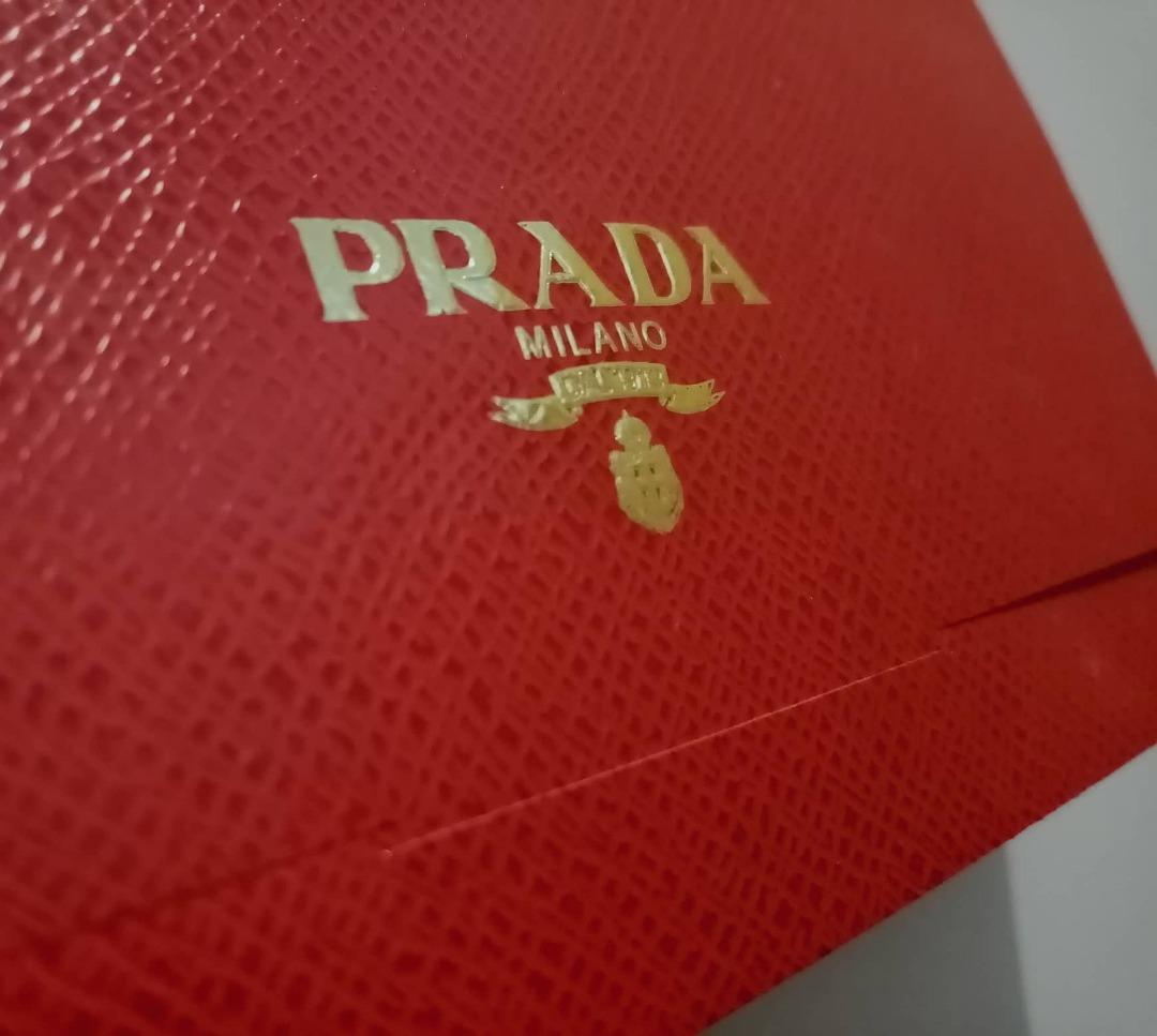 Original PRADA Cash Envelope (Category: Luxury Bags & Wallets) located in Taguig. Submitted by sprooced (Listing ID 1184967634, Image 2). Description: - Non-merchandise (free from purchase in Prada Singapore) - Php 250/piece - The seller is not associated/connected with Prada - ONLY SENDING PARCELS WITHIN METRO MANILA Via Grab - WILL NEVER USE GOGO EXPRESS DUE TO A BAD EXPERIENCE.