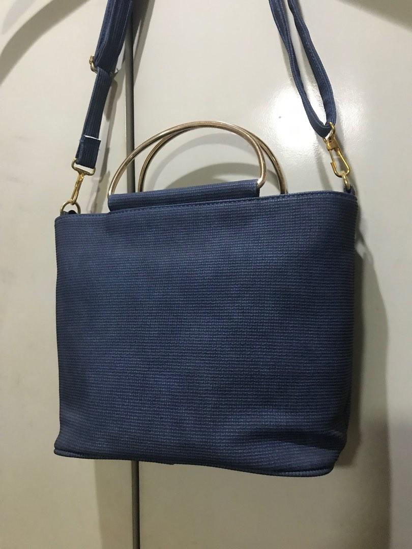 Cloth 2-way Bag - Brand New (Category: Cross-body Bags) located in San Juan City. Submitted by polkadotcom (Listing ID 1185263494, Image 2). Description: Unused Cloth adjustable strap Metal handle Zippered interior With 2 compartments plus a zippered pocket No issues with hardware and zippers #septsale.