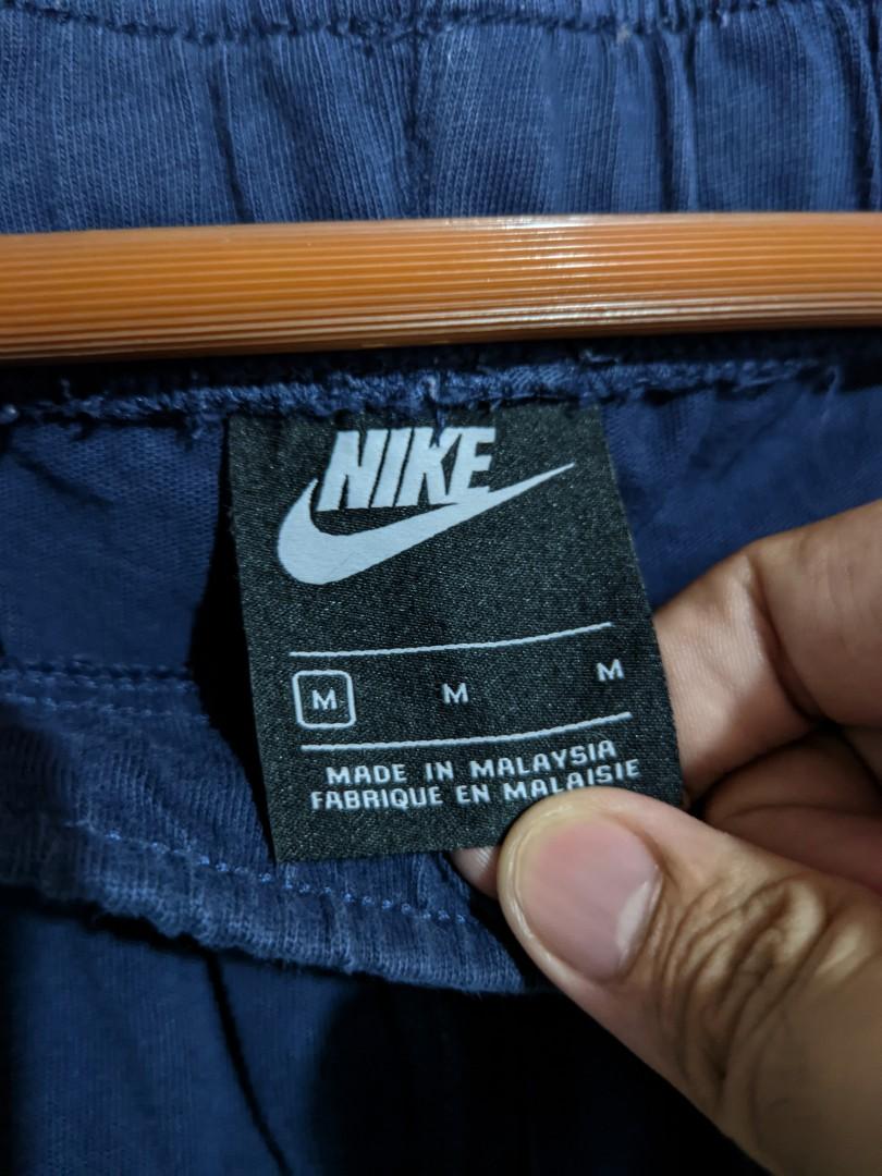 nike logo all over sweatpants