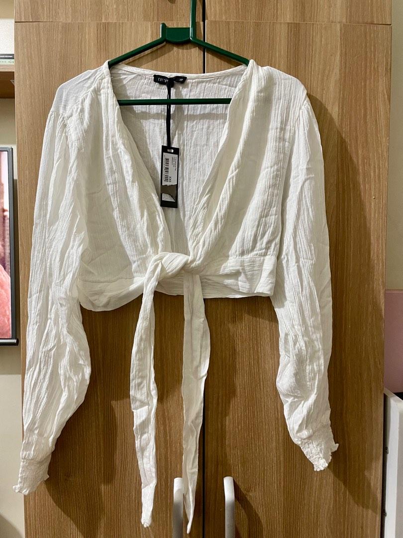 Cotton On white cover top (Category: Others Tops) located in Mandaluyong City. Submitted by declutterbylyzeey (Listing ID 1185373067, Image 1). Description: .