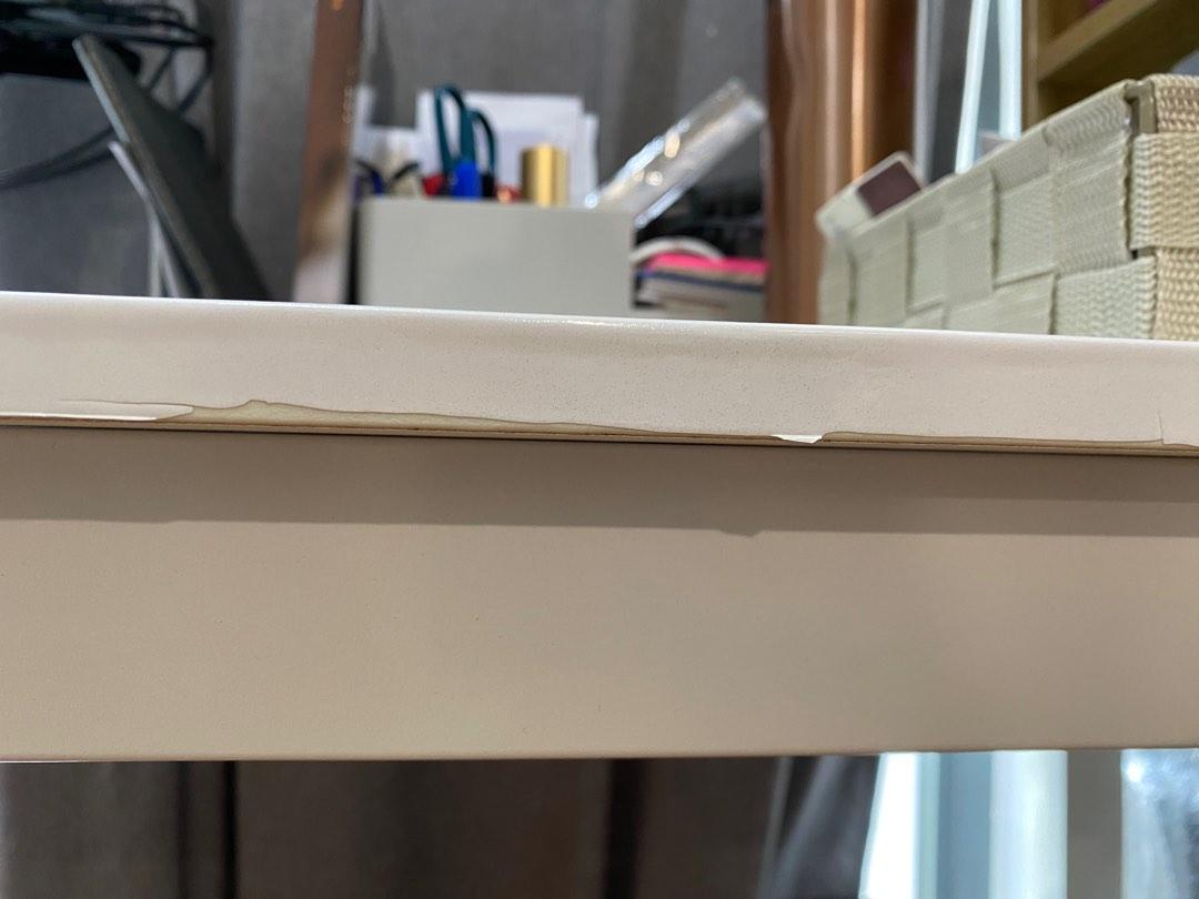 Work/Study/Console Table (Category: Tables & Sets) located in Singapore. Submitted by bumblebeev (Listing ID 1185296780, Image 3). Description: Laminated metal table top with metal legs Table only, all items in picture are not included. Table top surface is still smooth, stain free See 3rd pic for peels at the side Take note of table structure if you intent to mount a monitor stand or measure space to slot a chair in. Wood boards are my own adjus