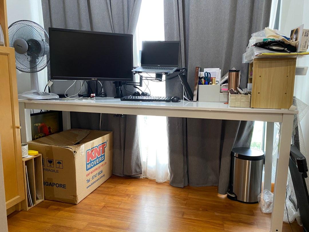 Work/Study/Console Table (Category: Tables & Sets) located in Singapore. Submitted by bumblebeev (Listing ID 1185296780, Image 2). Description: Laminated metal table top with metal legs Table only, all items in picture are not included. Table top surface is still smooth, stain free See 3rd pic for peels at the side Take note of table structure if you intent to mount a monitor stand or measure space to slot a chair in. Wood boards are my own adjus