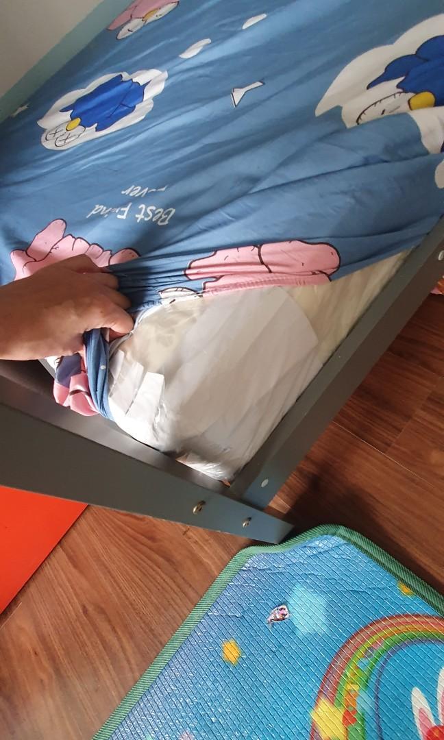 Bunk bed with Singlesized mattresses still in plastic wrapping