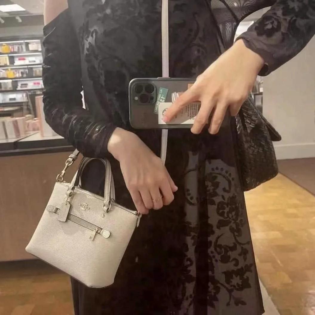 Coach mini tote (Category: Cross-body Bags) located in Manila. Submitted by gff.daily_flower (Listing ID 1185495264, Image 2). Description: Complete inclusion tag gift receipt dust bag, care card and paper bag.