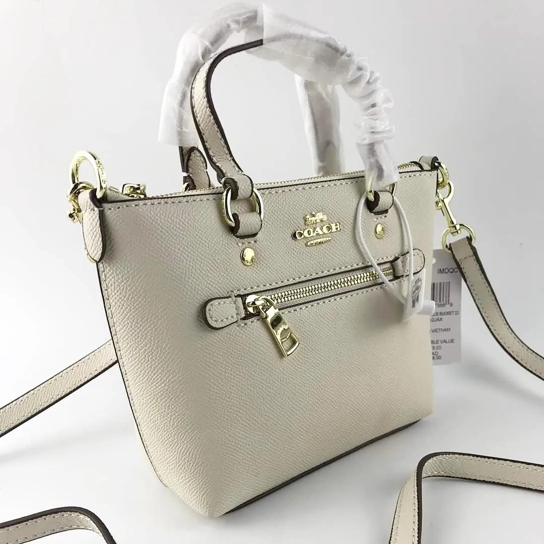 Coach mini tote (Category: Cross-body Bags) located in Manila. Submitted by gff.daily_flower (Listing ID 1185495264, Image 3). Description: Complete inclusion tag gift receipt dust bag, care card and paper bag.