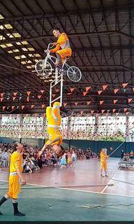 acrobatics show with high wire walker and bicycle act