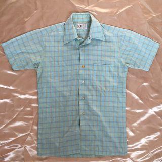 Light blue checkered polo shirt