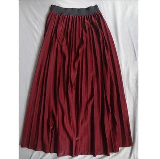 Red pleated maxi skirt