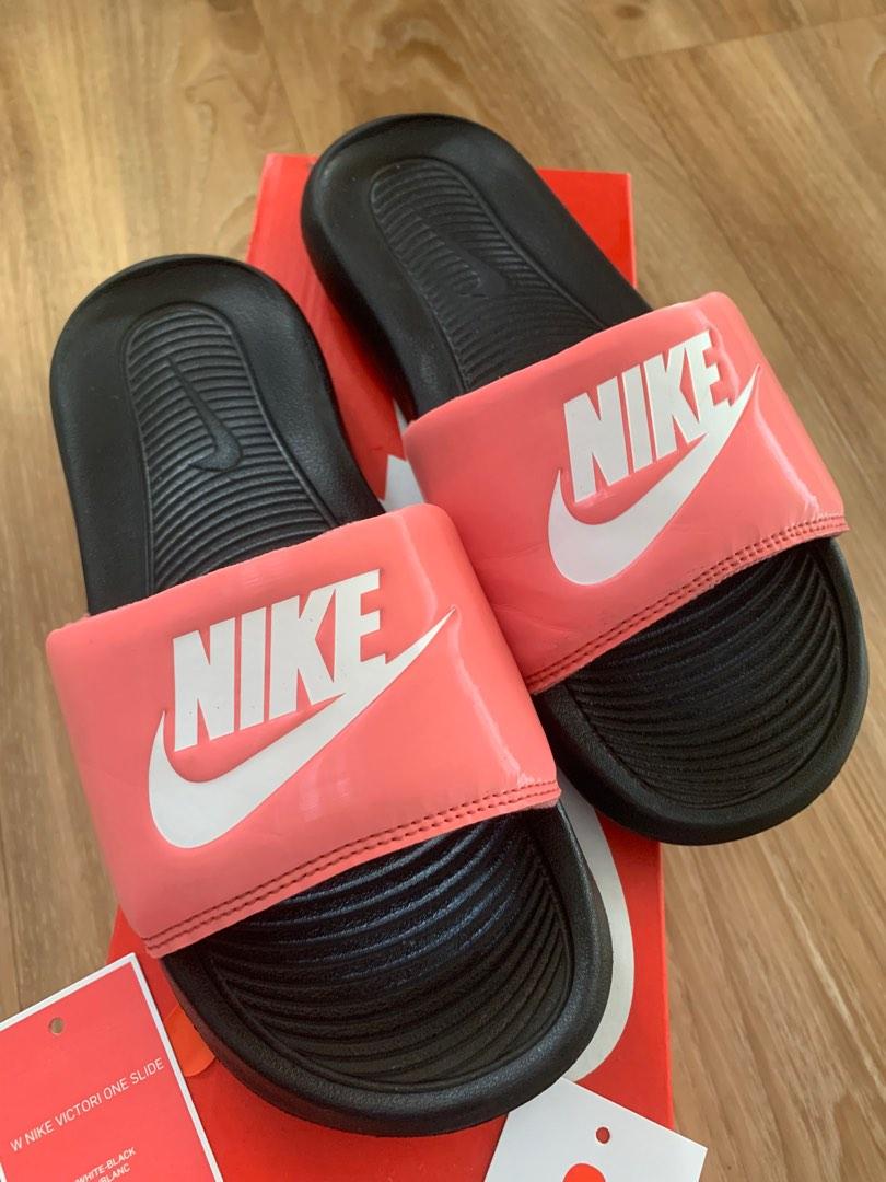 pink and orange nike slides