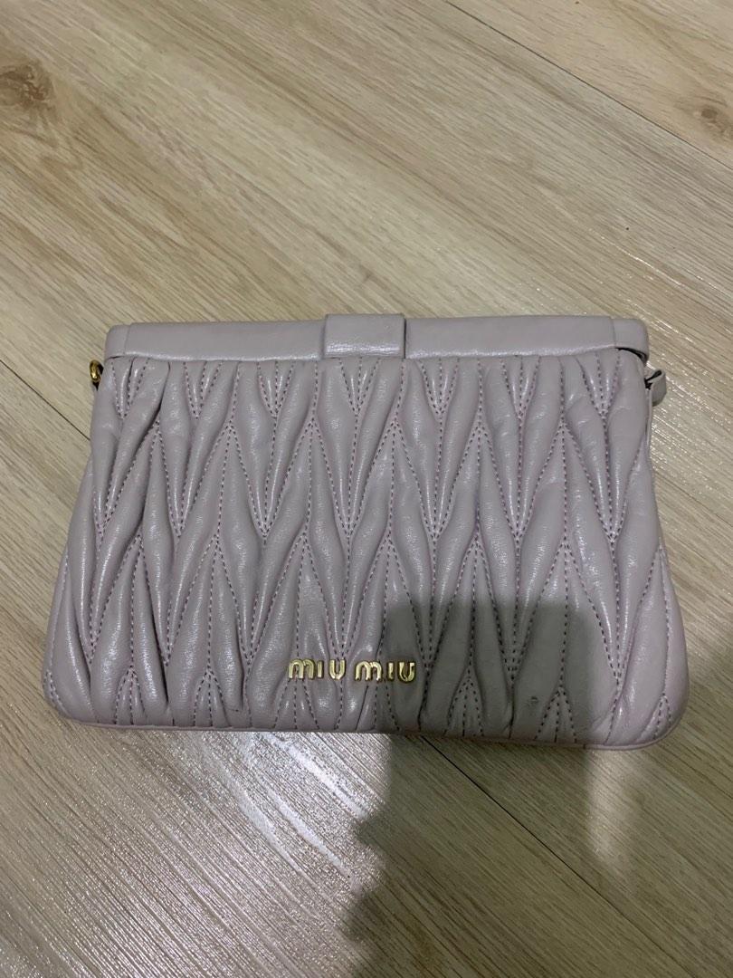 Miu Miu Clutch Bag (Category: Luxury Bags & Wallets) located in Tarlac. Submitted by ae01019x (Listing ID 1182343510, Image 1). Description: With signs of used missing metal strap holder on other side condition: 9/10 payment first.