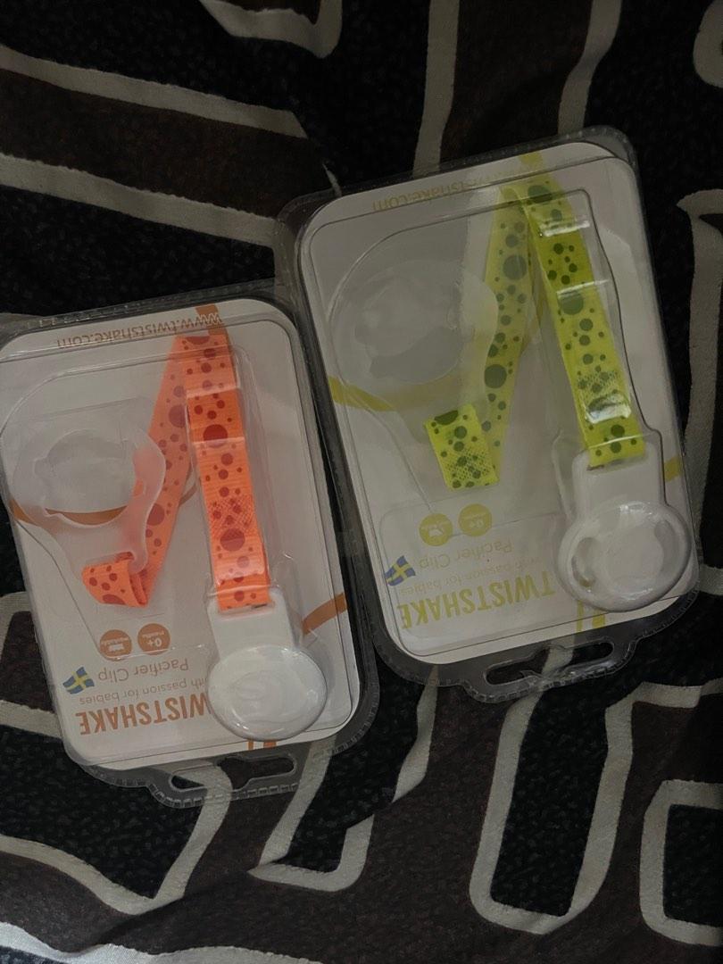 Twistshake pacifier and holder (Category: Soothers & Pacifiers) located in Manila. Submitted by thelovelymd (Listing ID 1182417425, Image 2). Description: Get the 2 pacifier and the orange clip holder for 300- all new and sealed (used na po ung yellow but like new, I can give it if hindi naman maselan) *last 3 pictures for reference RFS: given too many pacifiers and teethers.