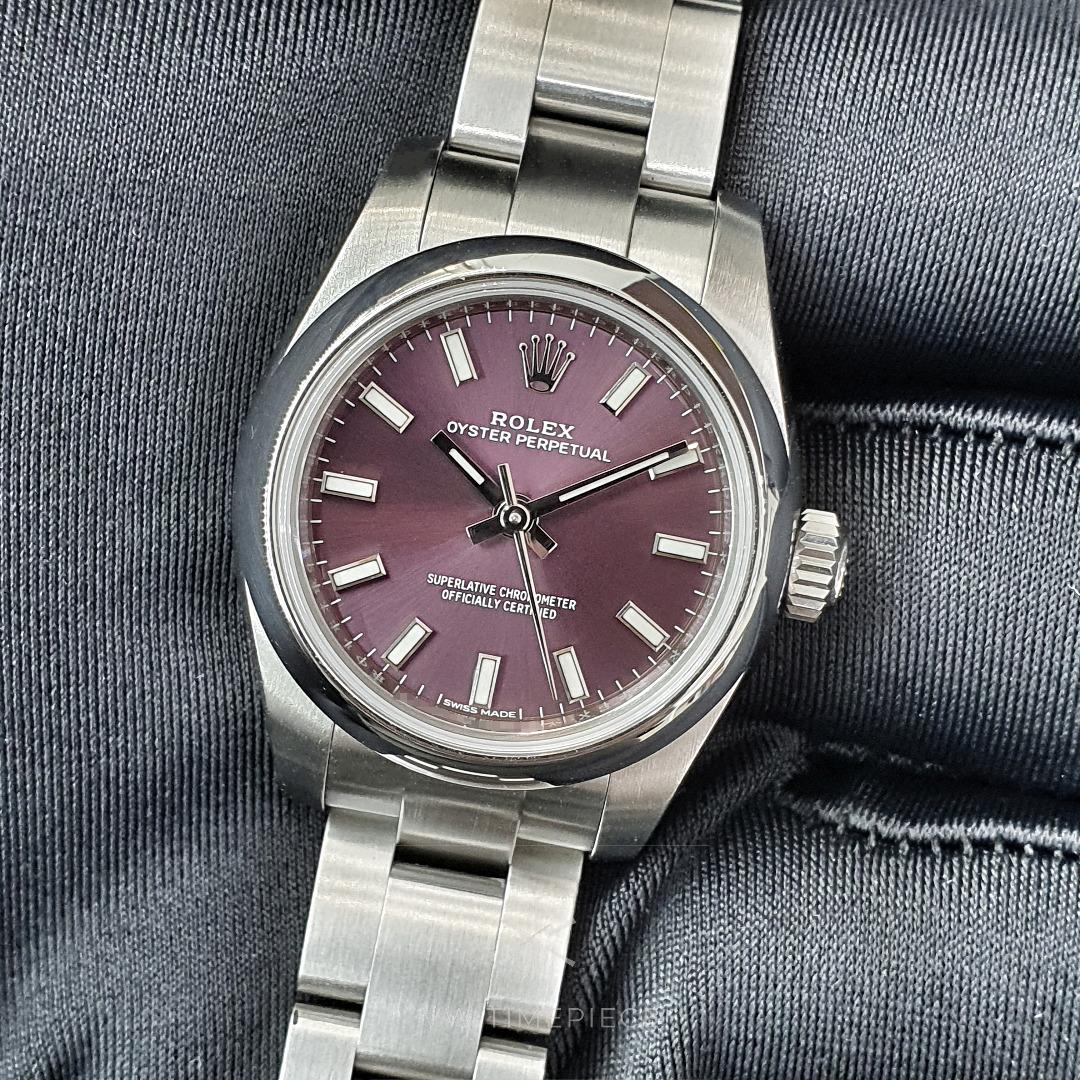 Rolex Oyster Perpetual 26 Ref 176200 Purple Grape Dial (2019) (Category: Watches) located in Singapore. Submitted by vwtimepiece (Listing ID 1186136863, Image 1). Description: Rolex Oyster Perpetual 26 Purple (discontinued colour!) Comes with: tag and warranty card dated May 2019 (Singapore). No original Rolex box. 12 months in-store warranty for movement SKU: V1E Ref: 176200 Serial: AN Year: 2019 Dial: Sunburst 'Grape' purple dial (discontinued 