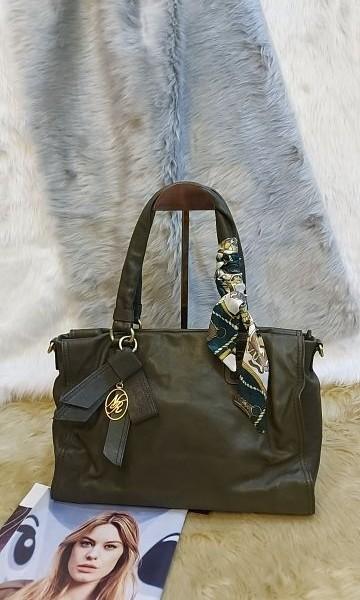 Original Nina Ricci (Category: Luxury Bags & Wallets) located in Quezon City. Submitted by SpringRain (Listing ID 1186419337, Image 2). Description: Original Nina Ricci Dark Green Color Crumpled Leather Style *No sling 8/10 Delivery Thru lalamove to be shouldered by buyer.