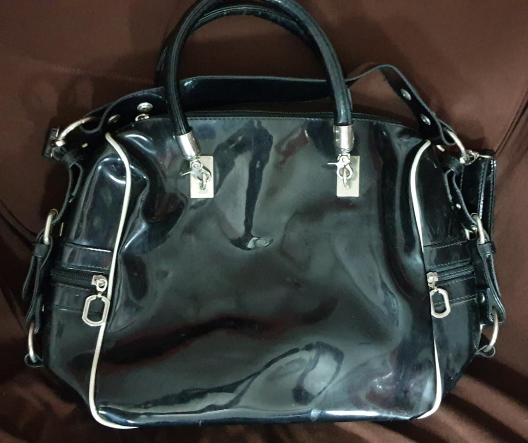 Chic Vinyl Black Shoulder/Cross Body Bag (Category: Shoulder Bags) located in Makati City. Submitted by michaelbryant (Listing ID 1186521990, Image 2). Description: Chic Vinyl Black Bag (can be used as a shoulder or cross body bag) Dimensions (LWH): 9" x 5" x 10" Condition: 8/10.