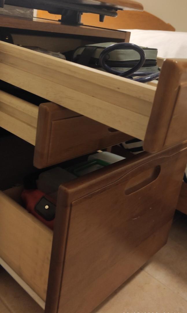 Side table/office table with drawers (Category: Tables & Sets) located in Bacoor. Submitted by chicolim (Listing ID 1186831031, Image 3). Description: Bought for 1,700 Japan cabinet Wood Drawers glide smooth With rollers May be used as office cabinet, side table Top may be adjusted up, down, forward Has a hole at the back, easily repaired/replaced with a board Still quite functional RFS: getting a new cabinet.